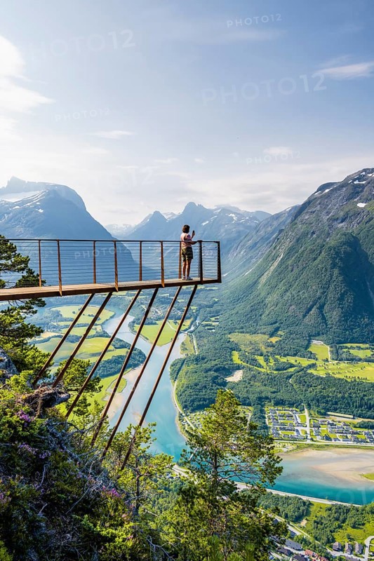 Hikers standing on viewing platform Rampestreken