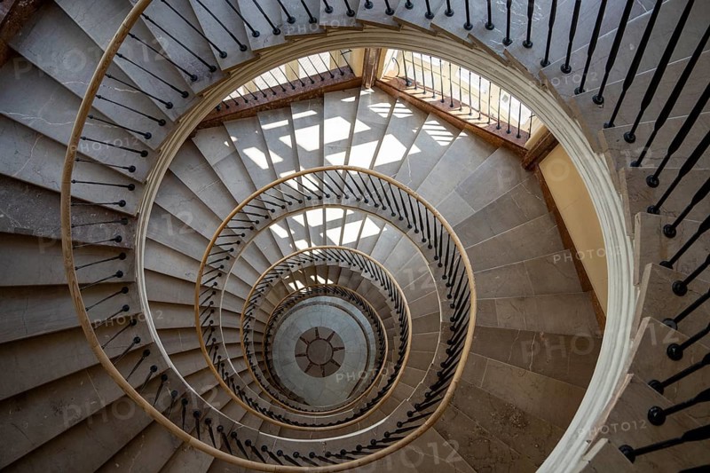 Beautiful winding staircase in old tenement house in Warsaw