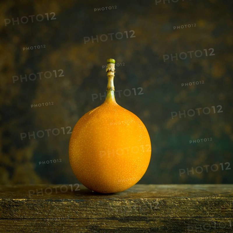 Grenadilla. Passion fruit on brown background