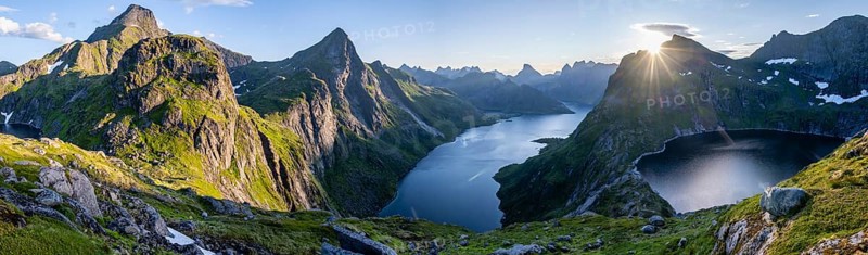 Hiker looking at mountain landscape with fjord Forsfjorden