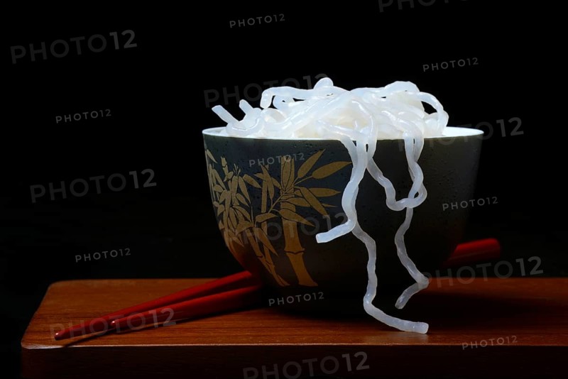 Shirataki noodles made from konjac flour in a bowl with chopsticks