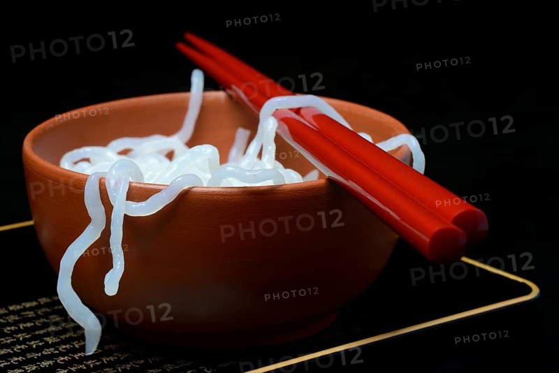 Shirataki noodles made from konjac flour in a bowl with chopsticks