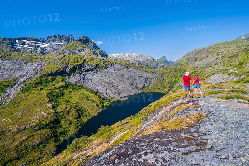 Hikers looking at mountain landscape