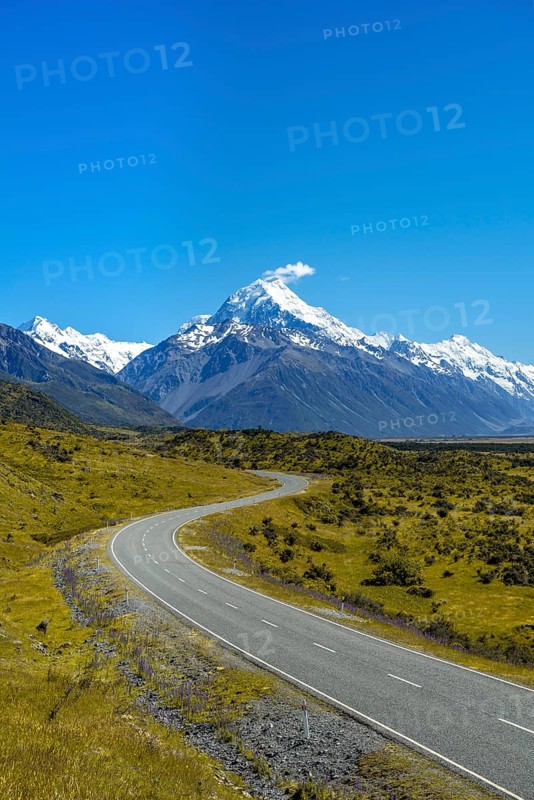 Country road overlooking snow-capped Mount Cook National Park