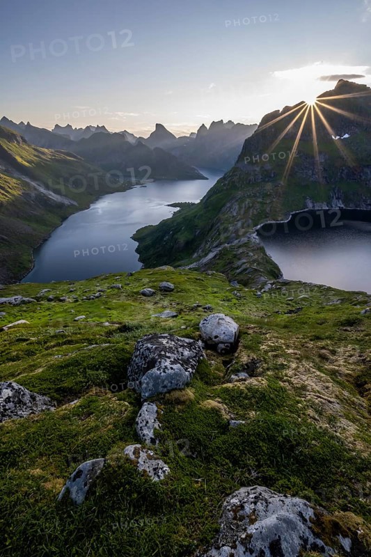 Sun shining over mountain landscape with fjord Forsfjorden and lake Krokvatnet