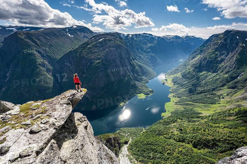 Hiker standing on rocky outcrop