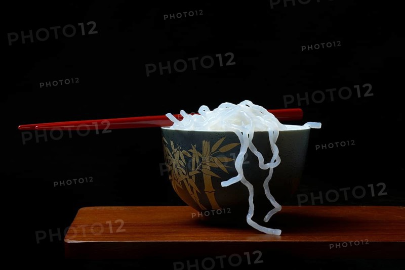 Shirataki noodles made from konjac flour in a bowl with chopsticks