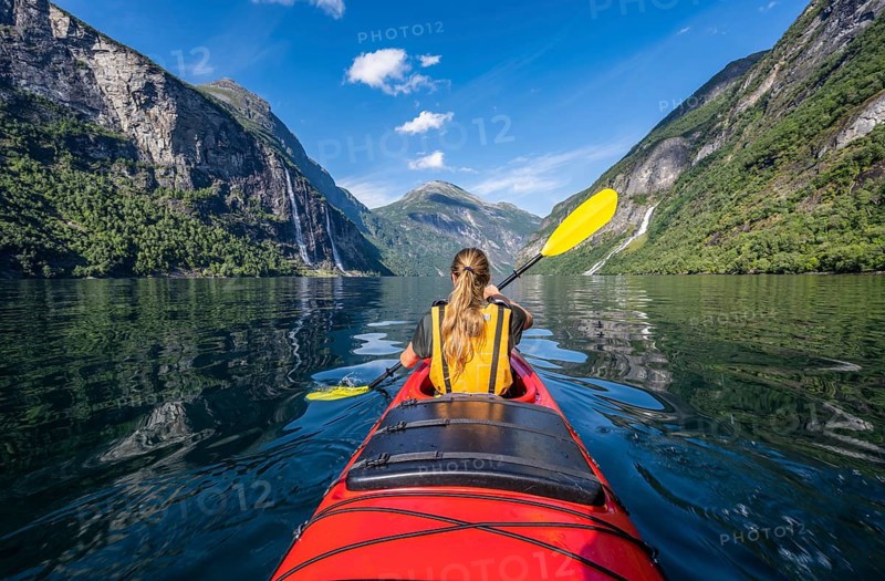 Young woman paddling in a kayak