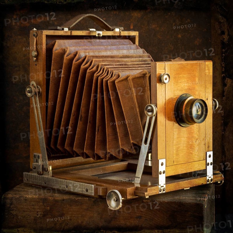 Old camera on brown background