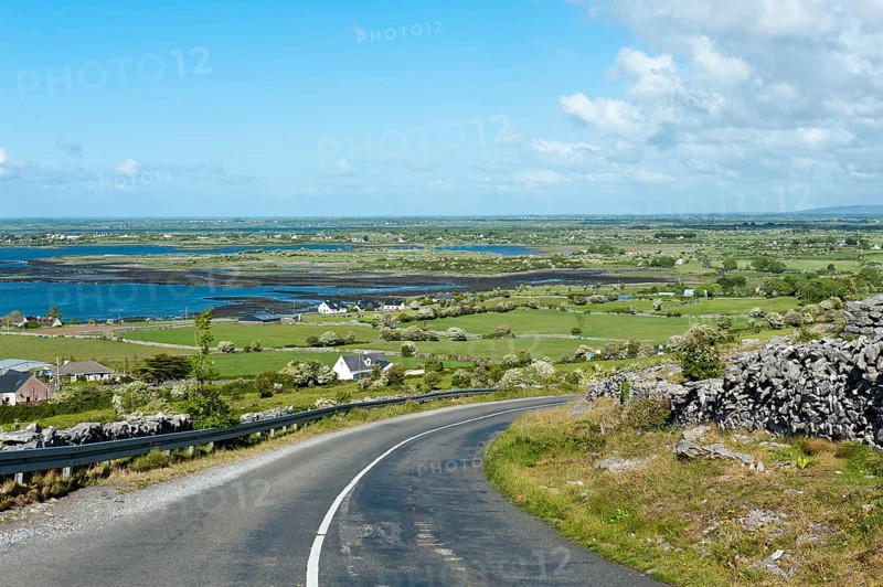 Lonely country road through the karst landscape of The Burren