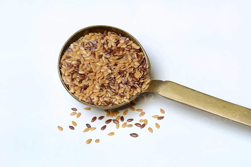 Yellow and brown linseed in trowel