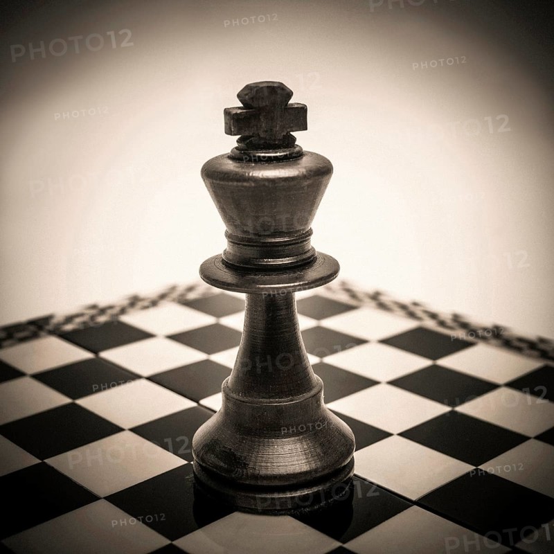King chess piece on chessboard