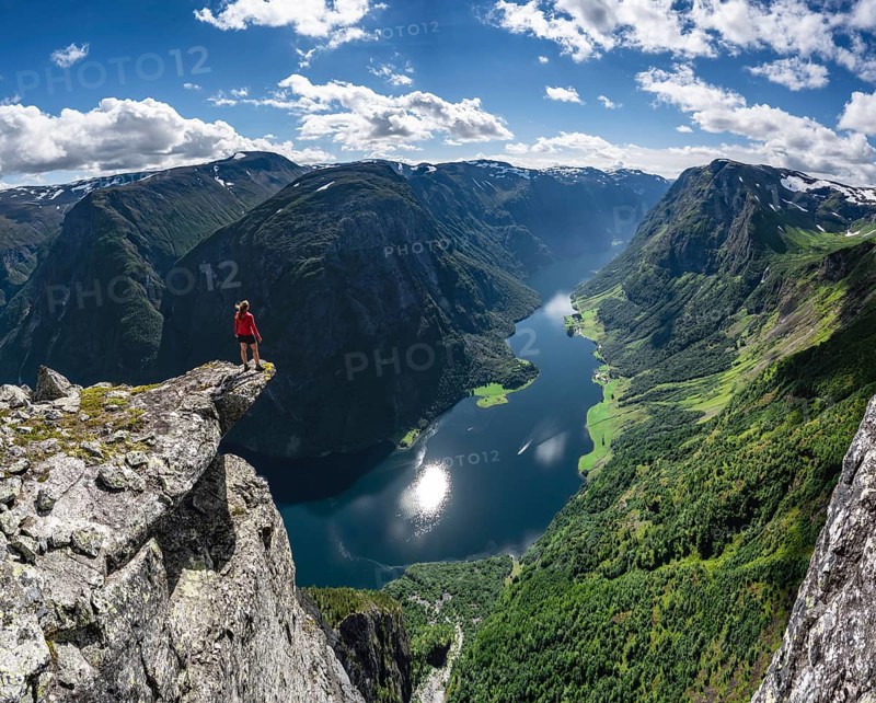 Hiker standing on rocky outcrop