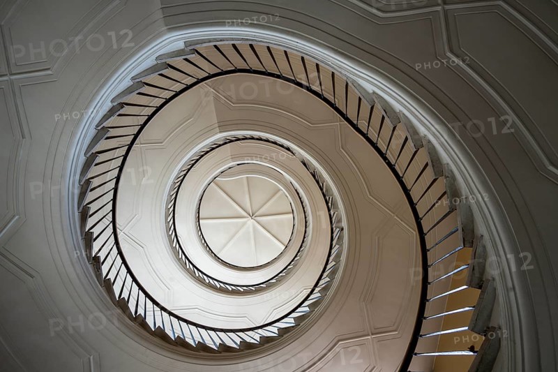 Beautiful winding staircase in old tenement house in Warsaw