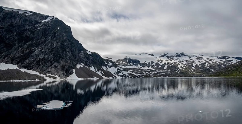 Snow and ice floating on lake Djupvatnet