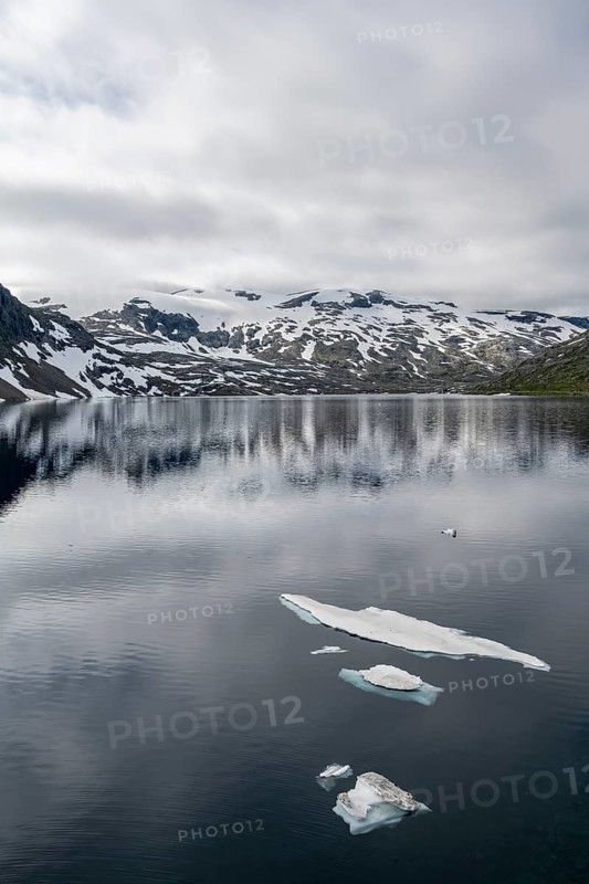 Snow and ice floating on lake Djupvatnet