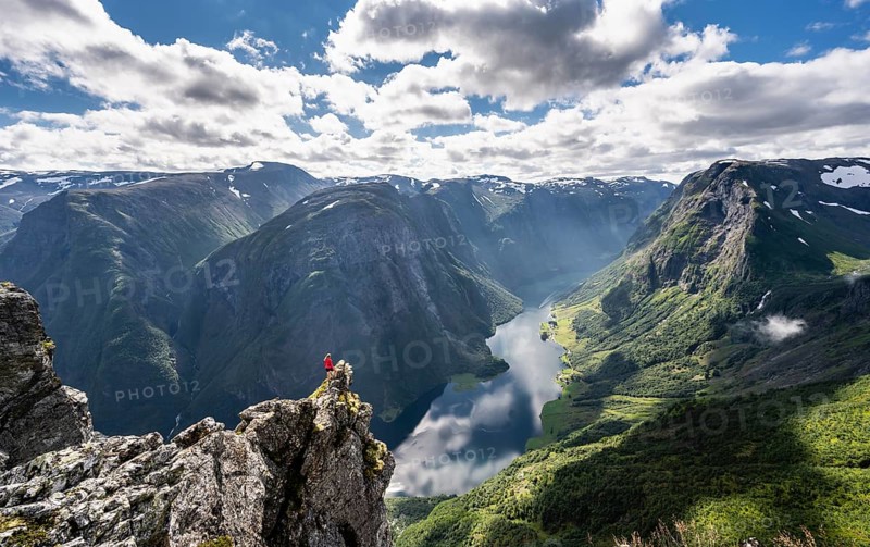 Hiker standing on rocky outcrop