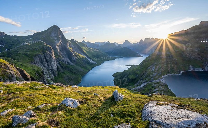 Sun shining over mountain landscape with fjord Forsfjorden and lake Krokvatnet