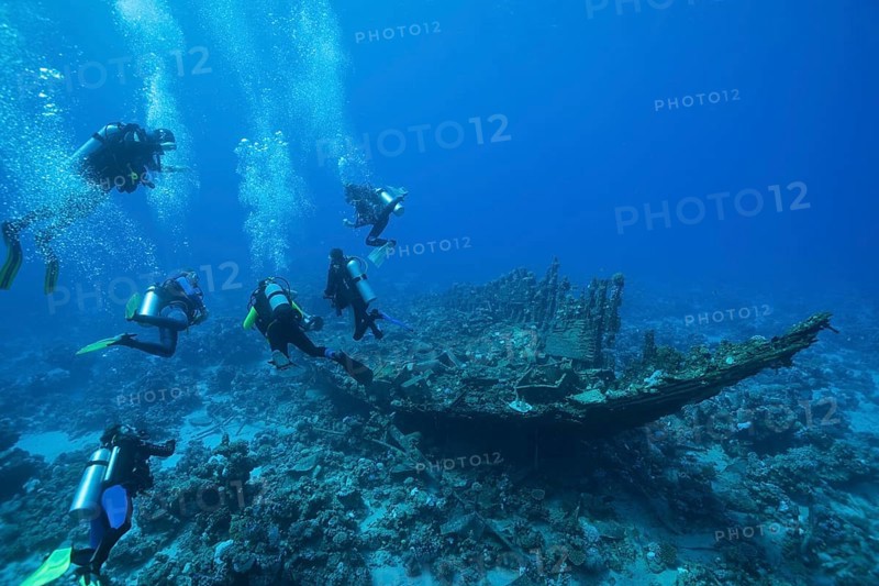 Divers on the wreck of the Heaven One