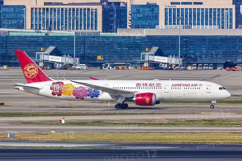 A Boeing 787-9 Dreamliner aircraft operated by Juneyao Air with registration number B-209R at Shanghai Airport