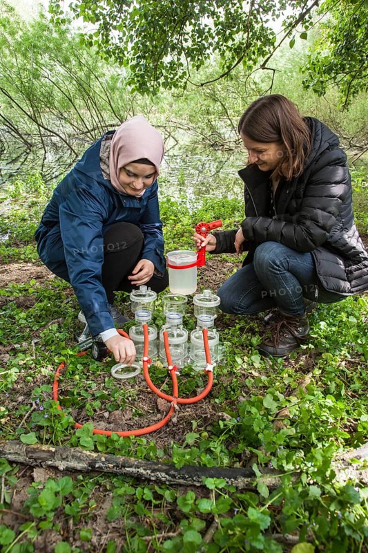 Scientists of the working group of Prof. Dr. Jens Boenigk of the University of Duisburg-Essen filtering water samples near Grietherbusch on the Lower Rhine