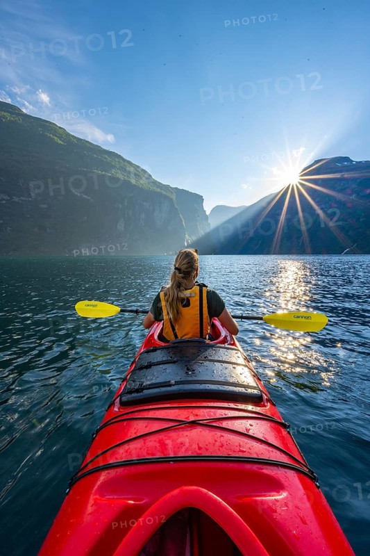 Young woman paddling in a kayak