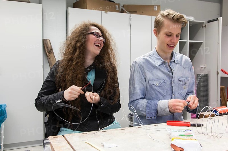 Students in the design class make a work of art with wire