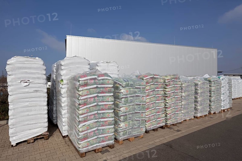 Stacked bags of potting soil and garden mulch for the spring shop