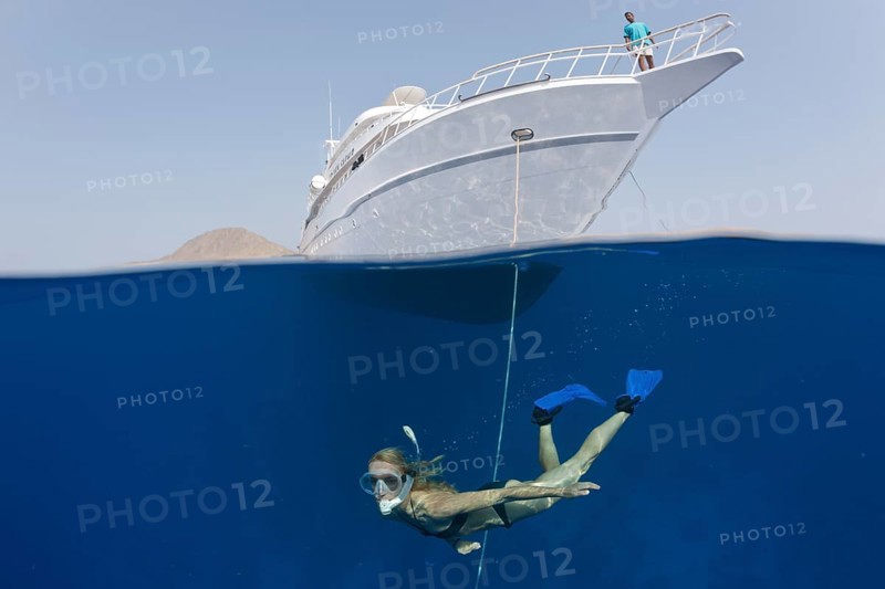 Snorkeling in front of safari ship