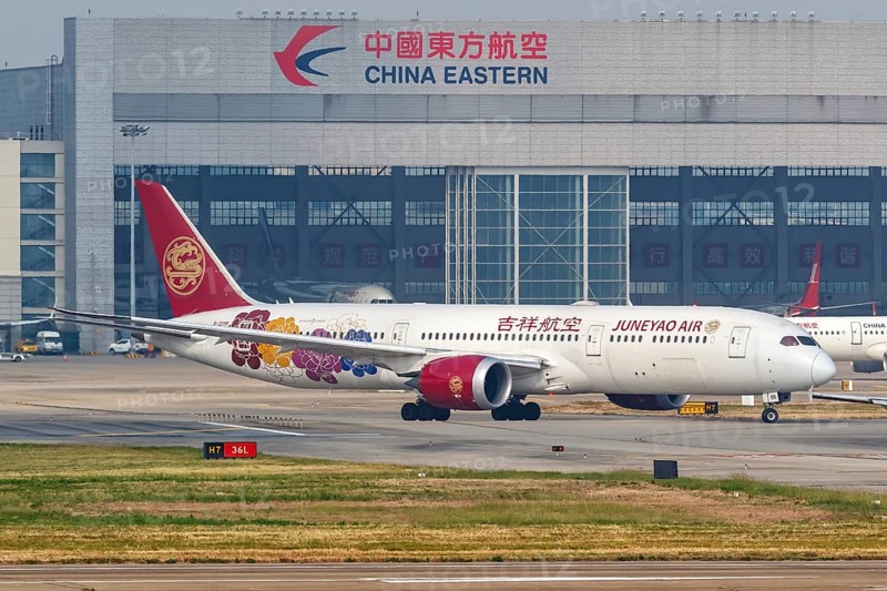 A Boeing 787-9 Dreamliner aircraft operated by Juneyao Air with registration number B-209R at Shanghai Airport