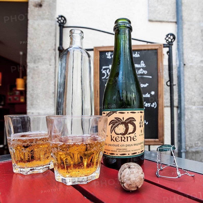 Cider bottle with glasses and a cork