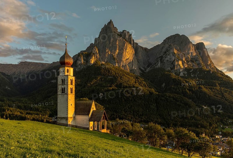 Church San Valentino in the evening light in front of the Schlern