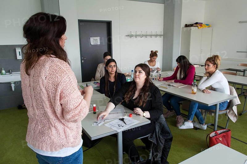 Vocational school students in class of the vocational training to become a beautician. Dual system at the Elly-Heuss-Knapp-Schule