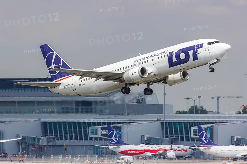 A Boeing 737-400 aircraft of LOT Polskie Linie Lotnicze with registration SP-LLG at Warsaw Airport