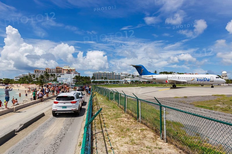A Fokker 70 of Insel Air with the registration P4-FKC at the airport of St. Maarten