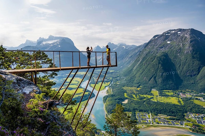 Hikers standing on viewing platform Rampestreken