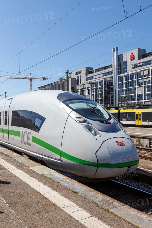 ICE 3 Velaro D train multiple unit locomotive in Stuttgart main station in Germany portrait format