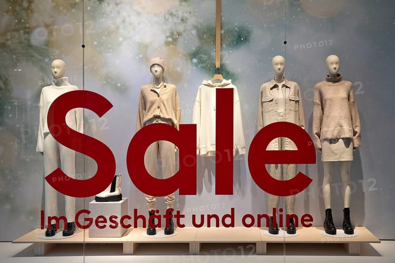 Shop window of a clothing store with the inscription Sale