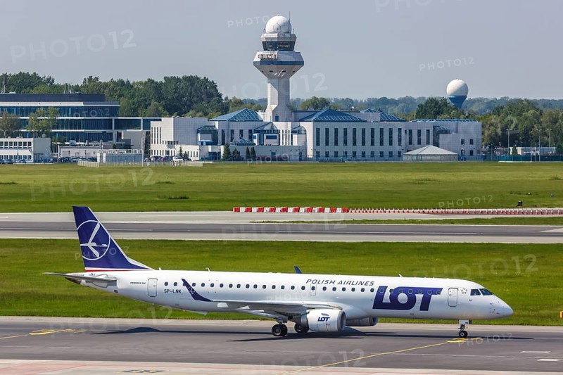 An Embraer 195 of LOT Polskie Linie Lotnicze with the registration SP-LNK at Warsaw Airport