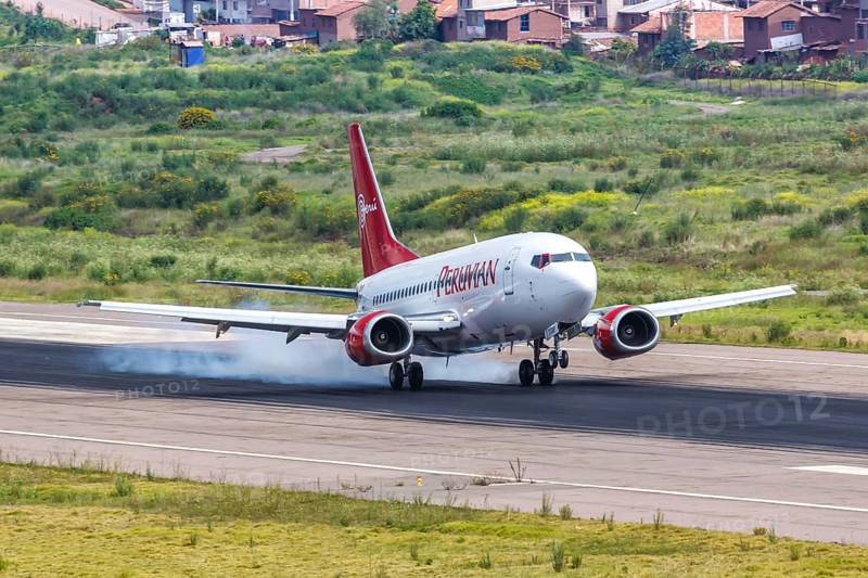 A Peruvian Boeing 737-500 aircraft with registration number OB2138P lands at Cuzco airport