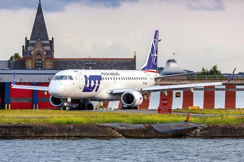 An Embraer 190 of LOT Polskie Linie Lotnicze with the registration SP-LMC at London City Airport