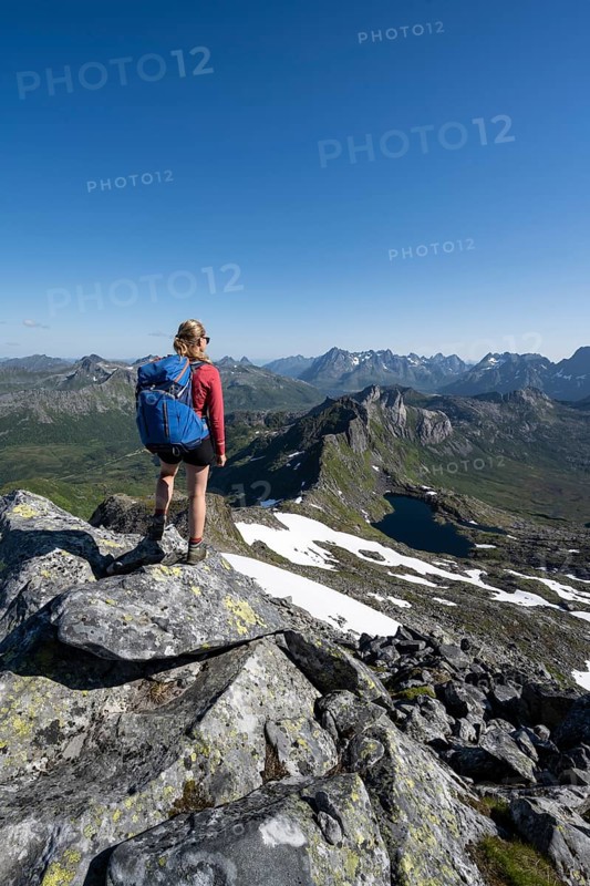Hiker on the trail to the mountain Rundfjellet