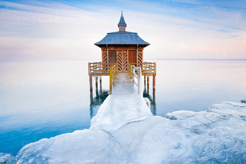 Iced bathhouse at dusk