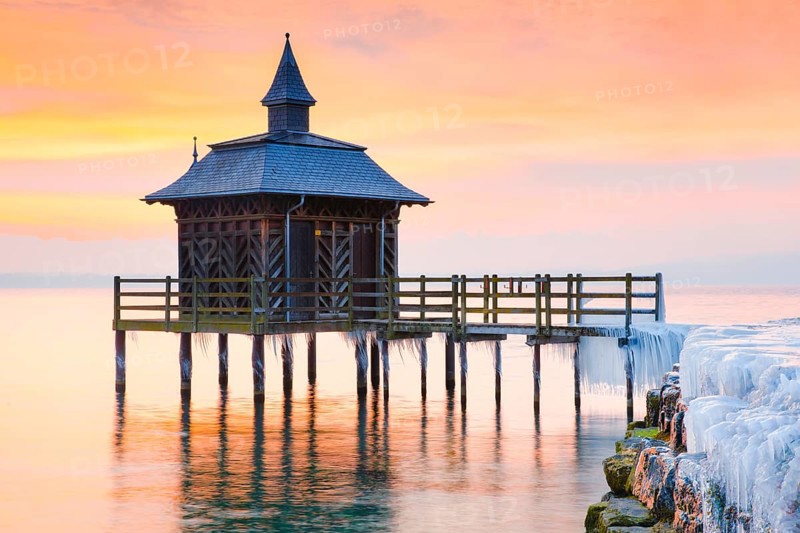 Iced bathhouse at sunrise