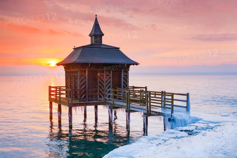 Iced bathhouse at sunrise