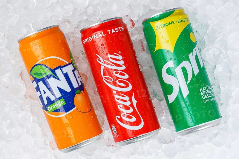 Coca Cola Coca-Cola products Fanta Sprite lemonade soft drink drinks in can ice cube ice cubes against a white background in Germany