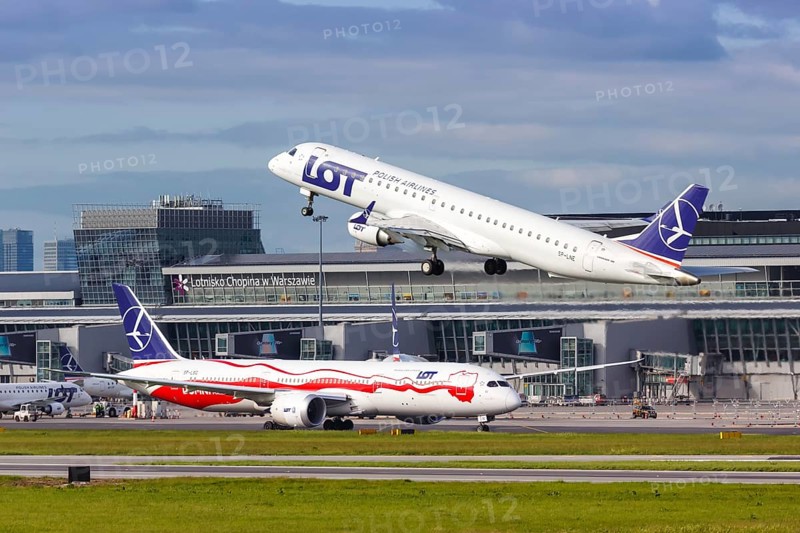 An Embraer 195 of LOT Polskie Linie Lotnicze with the registration SP-LNE takes off from Warsaw Airport