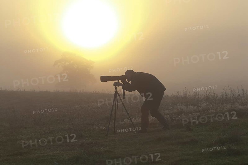 Nature photographer at sunrise