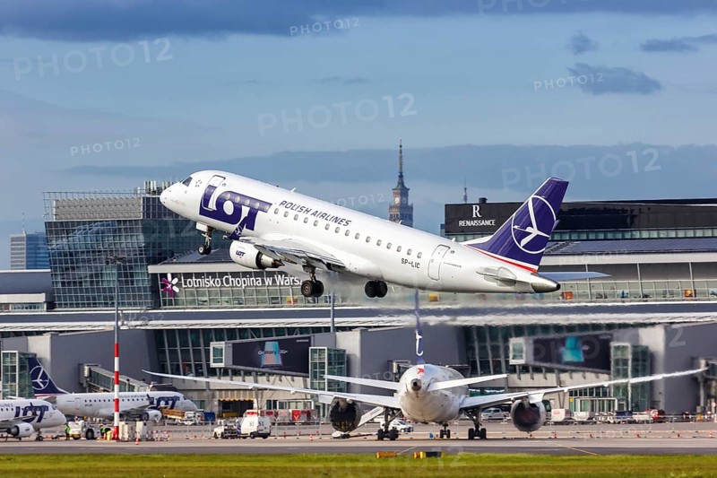 An Embraer 175 of LOT Polskie Linie Lotnicze with the registration SP-LIC takes off from Warsaw Airport