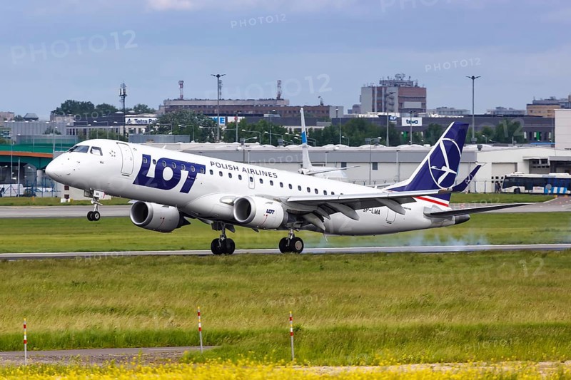 An Embraer 190 of LOT Polskie Linie Lotnicze with the registration SP-LMA lands at Warsaw Airport